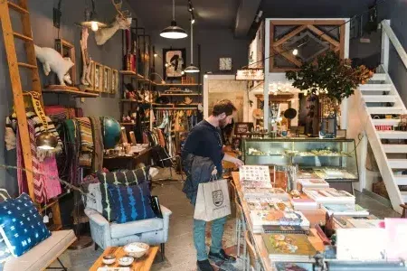 A man shops for items inside a boutique in 贝博体彩app's NoPa neighborhood.